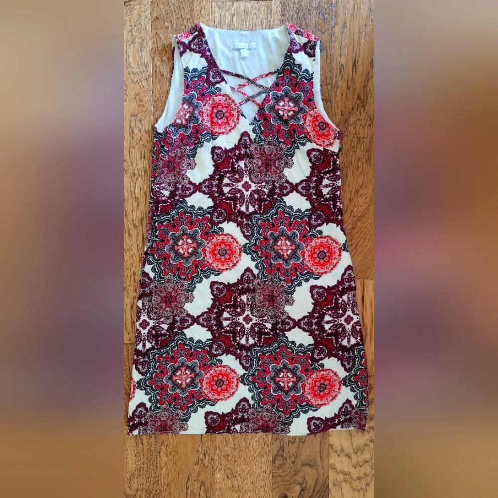 A pretty shift dress , v neck with crisscross detail on the neckline